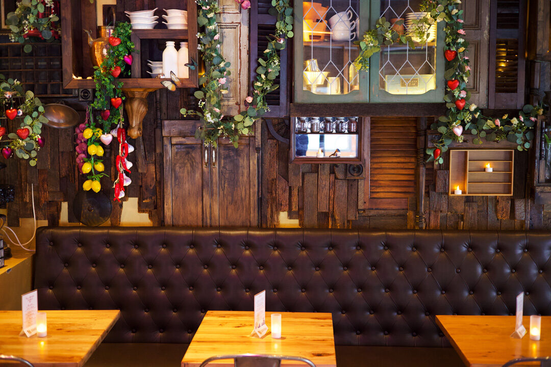 The warm, candlelit dining room at Enthaice
